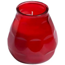 Red glass candle holder with a lit candle on a white background